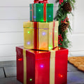 Cadeaux de Noël empilés lumineux d'extérieur